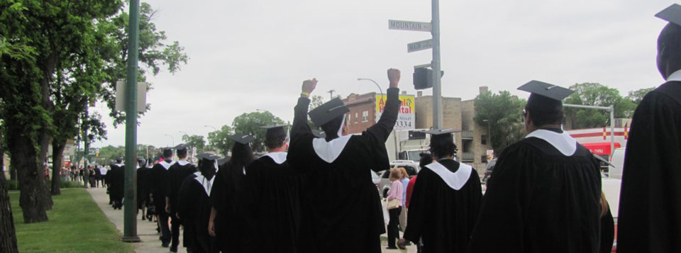 Students celebrating their great accomplishment as they walk over to Holy Trinity Church for convocation.